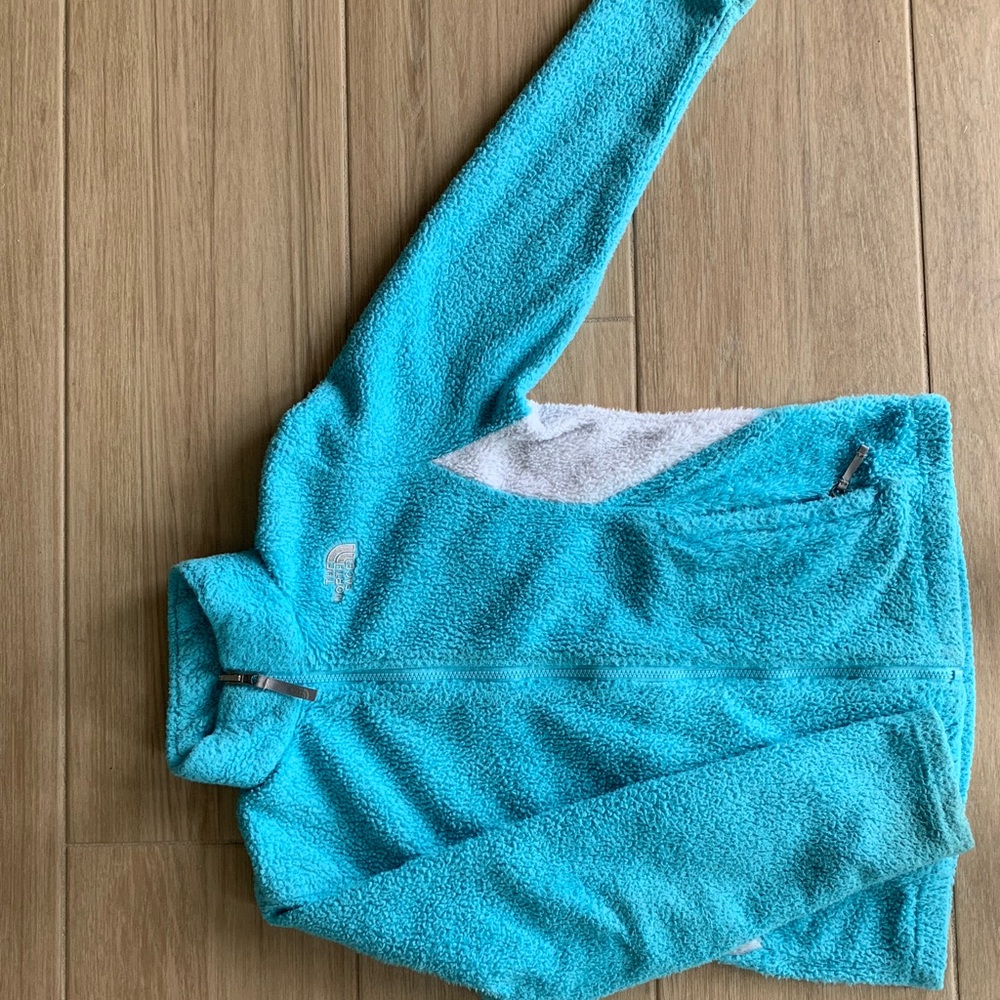 The North Face blue zip up jacket with pockets